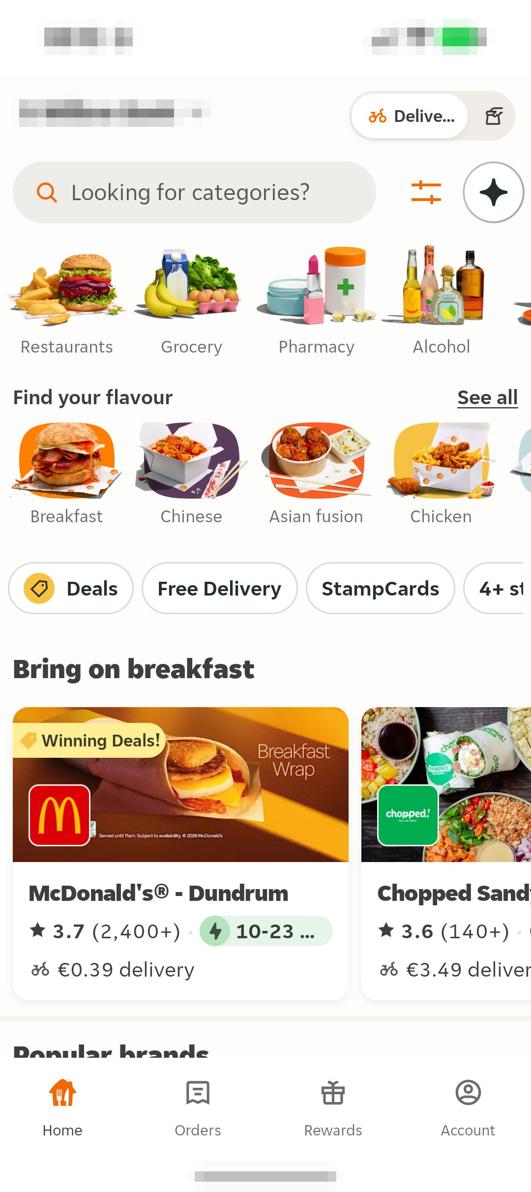 Just Eat 首页显示位置、Delivery 和 Collection、搜索框、分类和店铺卡片