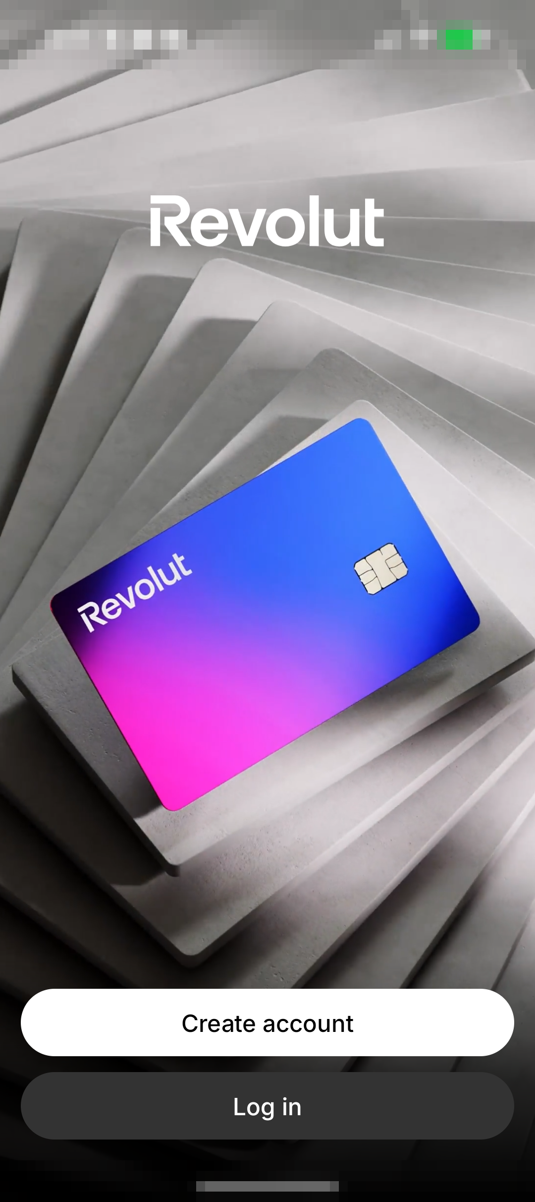 Revolut 应用欢迎页截图，显示 Revolut 标志、卡片背景和 Create account 创建账户入口。